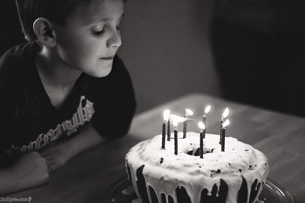 Austin lifestyle child photographer birthday cake candles wish